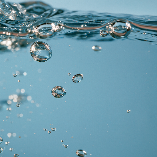 Blue liquid with floating air bubbles representing Marine Biotech Ferment
