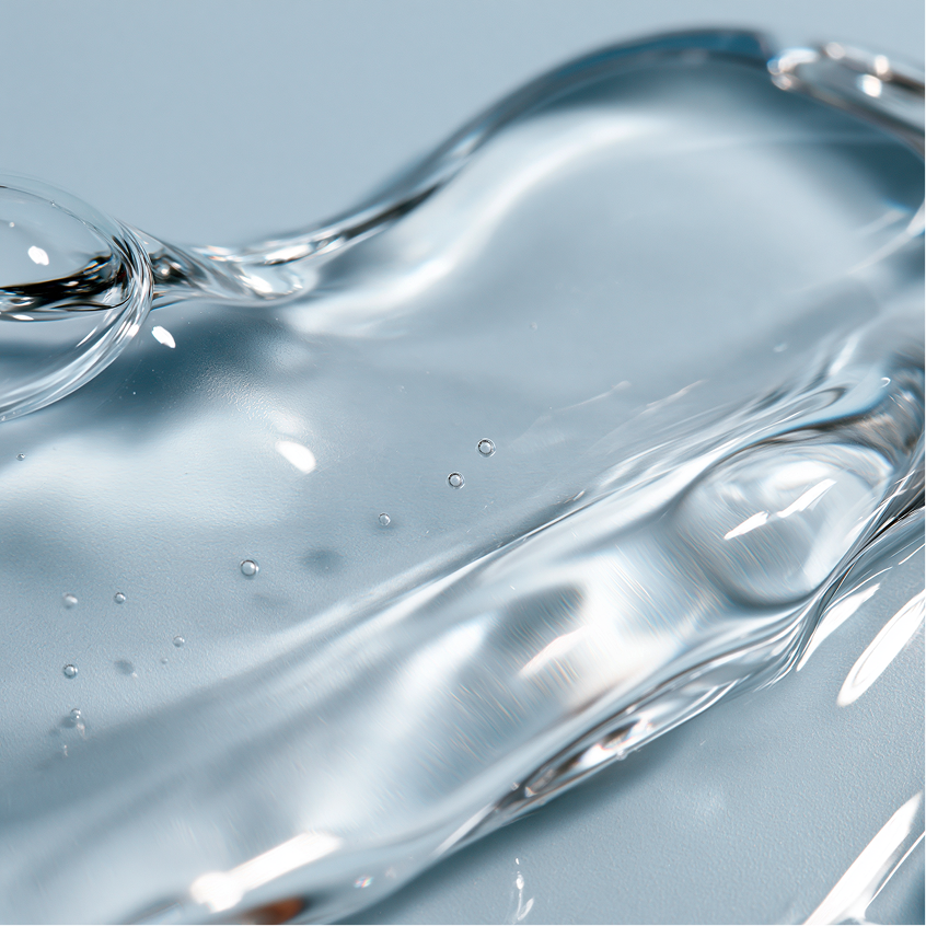 Close-up of transparent flowing serum representing longevity-supporting skincare ingredients