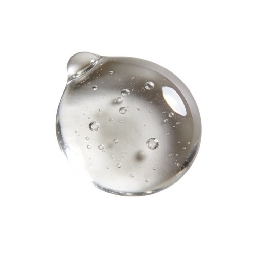 Clear niacinamide serum gel with air bubbles on a white background